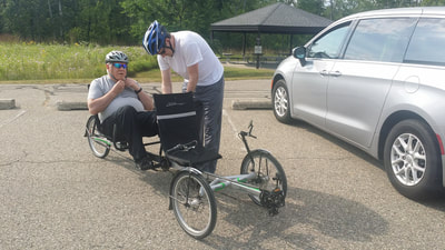 Attorney Dan Kosmowski with his father with dementia and PTSD preparing for a bike ride together