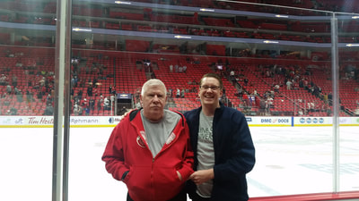 Attorney Dan Kosmowski with his father with dementia and PTSD at Little Caesars Arena